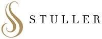 Stuller logo with elegant gold swirl and black text, representing fine jewelry design and craftsmanship