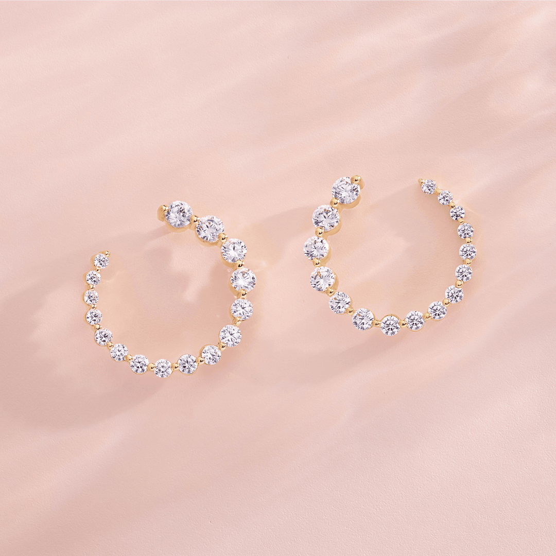 Gold hoop earrings with sparkling clear stones, elegant jewelry for everyday or special occasions