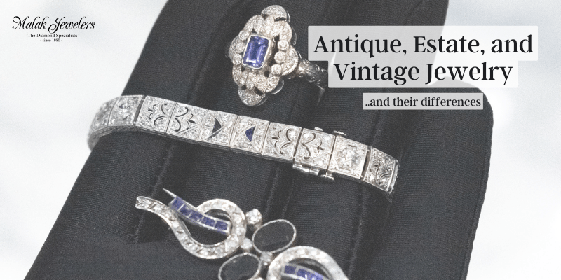 Antique estate vintage jewelry featuring sapphire and diamond pieces on black display