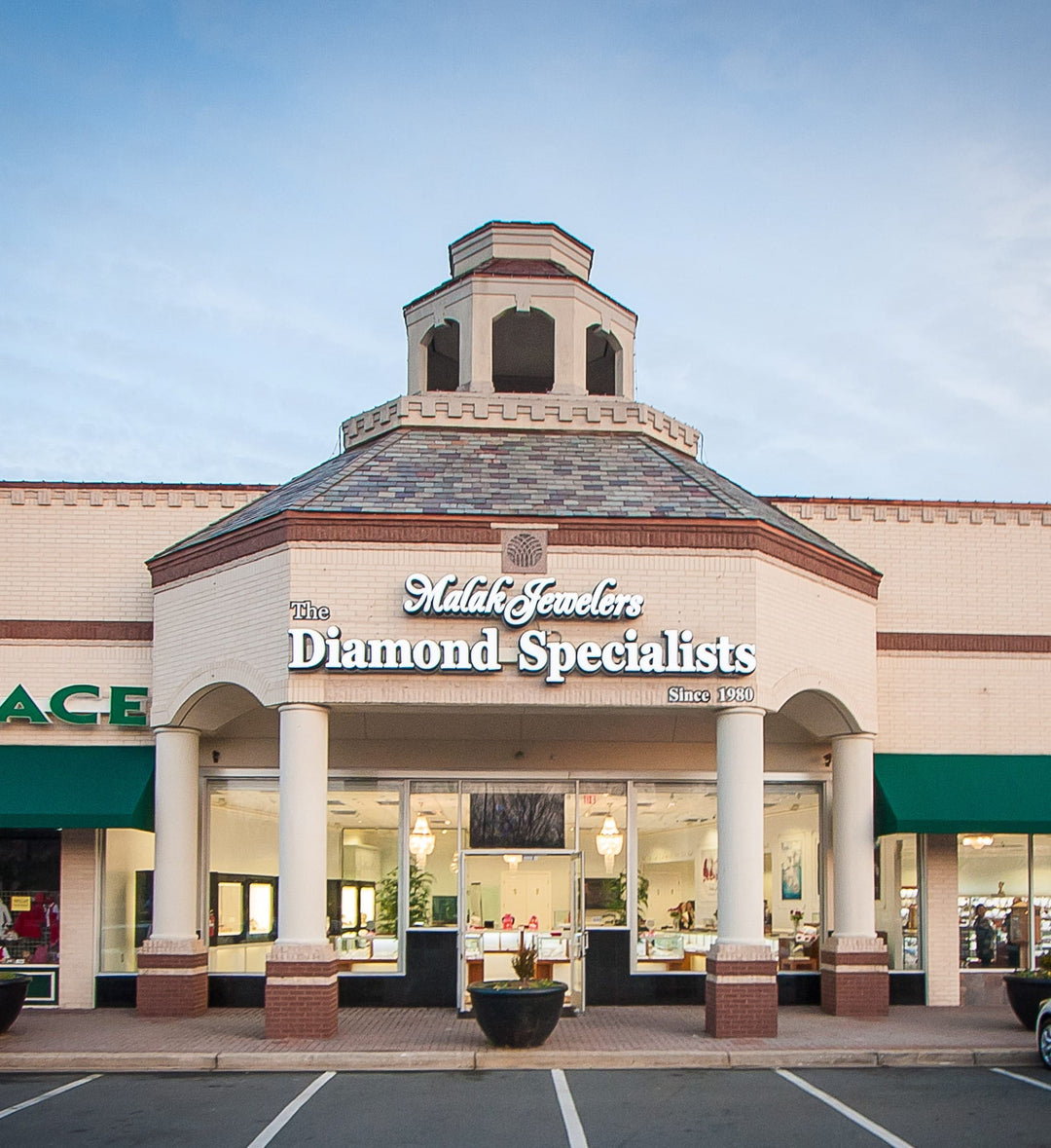 Malak Jewelers storefront, The Diamond Specialists since 1980, Charlotte NC jewelry store with elegant entrance and display windows