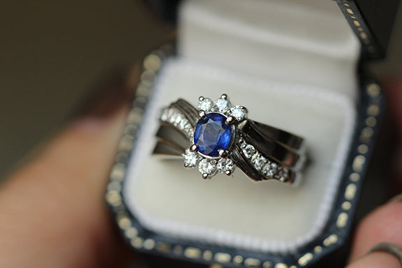 Elegant sapphire and diamond engagement ring in luxury jewelry box, perfect for Charlotte NC proposals